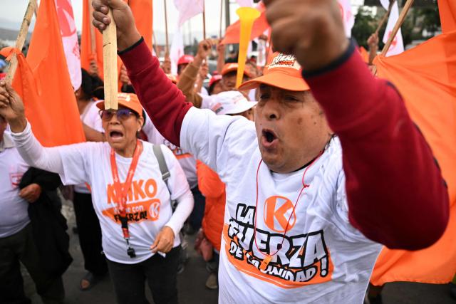 Supporters of Peru's presidential candidate for the Fuerza Popular party, Keiko Fujimori, chant slogans as they wait for her arrival at a closing campaign rally in Lima on June 4, 2026. Right-wing candidate Keiko Fujimori and leftist Roberto Sanchez will face off in Peru's presidential runoff on June 7, 2026. (Photo by MARTIN BERNETTI / AFP)