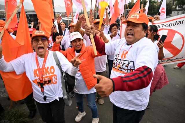 Supporters of Peru's presidential candidate for the Fuerza Popular party, Keiko Fujimori, chant slogans as they wait for her arrival at a closing campaign rally in Lima on June 4, 2026. Right-wing candidate Keiko Fujimori and leftist Roberto Sanchez will face off in Peru's presidential runoff on June 7, 2026. (Photo by MARTIN BERNETTI / AFP)