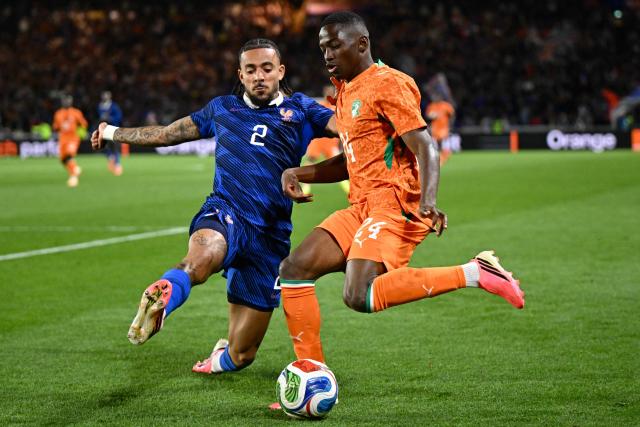 France's defender #02 Malo Gusto (L) and Ivory Coast's forward #24 Bazoumana Toure (R) fight for the ball during the international friendly football match between France and Ivory Coast ahead of the 2026 FIFA World Cup football tournament at the Stade de la Beaujoire in Nantes, western France, on June 4, 2026. (Photo by Loic VENANCE / AFP)