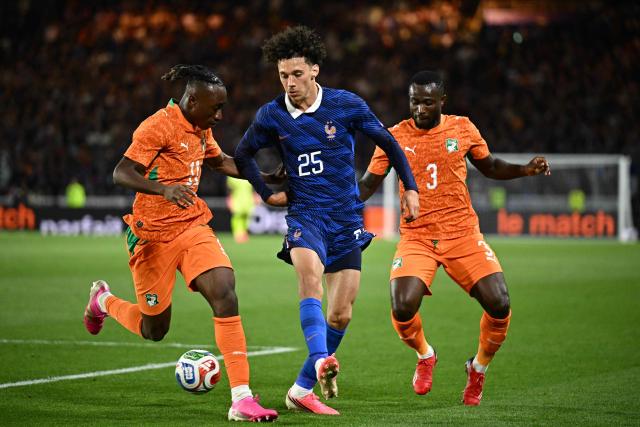 France's forward #25 Maghnes Akliouche (C) fights for the ball with Ivory Coast's forward #11 Yan Diomande (L) and Ivory Coast's defender #03 Ghislain Konan (R) during the international friendly football match between France and Ivory Coast ahead of the 2026 FIFA World Cup football tournament at the Stade de la Beaujoire in Nantes, western France, on June 4, 2026. (Photo by Loic VENANCE / AFP)