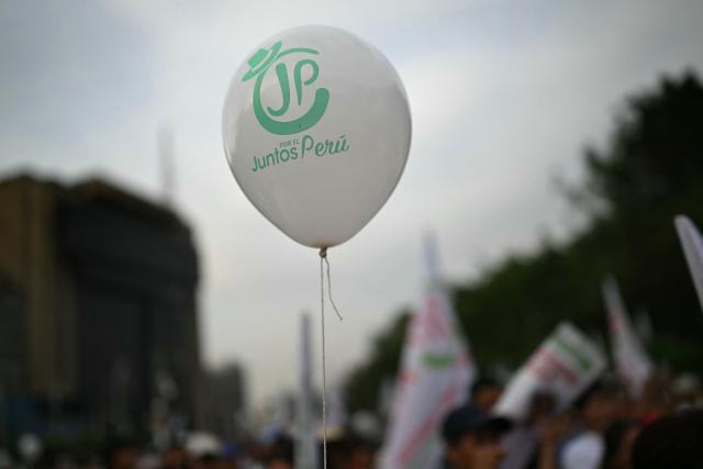 Supporters of Peru's presidential candidate for the Juntos por el Peru party, Roberto Sanchez, wait for the start of his closing campaign rally in Lima on June 4, 2026. Right-wing candidate Keiko Fujimori and leftist Roberto Sanchez will face off in Peru's presidential runoff on June 7, 2026. (Photo by ERNESTO BENAVIDES / AFP)