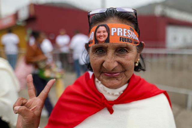 A supporter of Peru’s presidential candidate for the Fuerza Popular party, Keiko Fujimori, wears a headband with Keiko Fujimori’s image as they wait for her arrival at a closing campaign rally in Lima on June 4, 2026. Right-wing candidate Keiko Fujimori and leftist Roberto Sanchez will face off in Peru's presidential runoff on June 7, 2026. (Photo by Anthony NINO DE GUZMAN / AFP)