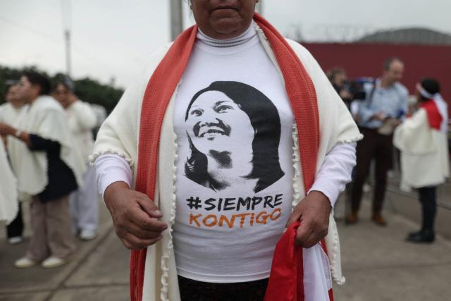 A supporter of Peru’s presidential candidate for the Fuerza Popular party, Keiko Fujimori, wears a T-shirt with her image as they wait for her arrival at a closing campaign rally in Lima on June 4, 2026. Right-wing candidate Keiko Fujimori and leftist Roberto Sanchez will face off in Peru's presidential runoff on June 7, 2026. (Photo by Anthony NINO DE GUZMAN / AFP)