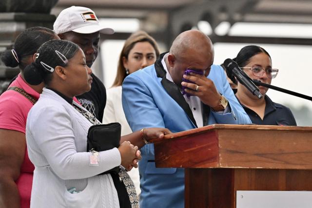 Luis Arroyo (C), father of Josue and Ismael Arroyo, gestures during a public apology event on behalf of the Ecuadorian government for the forced disappearance of the four children from the Malvinas, at the Rotonda hemicycle in Guayaquil, Ecuador, on June 4, 2026. (Photo by MARCOS PIN / AFP)