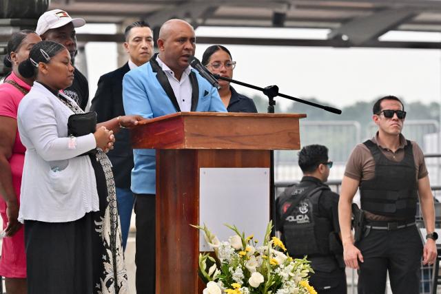 Luis Arroyo (C), father of Josue and Ismael Arroyo, speaks during a public apology event on behalf of the Ecuadorian government for the forced disappearance of the four children from the Malvinas, at the Rotonda hemicycle in Guayaquil, Ecuador, on June 4, 2026. (Photo by MARCOS PIN / AFP)