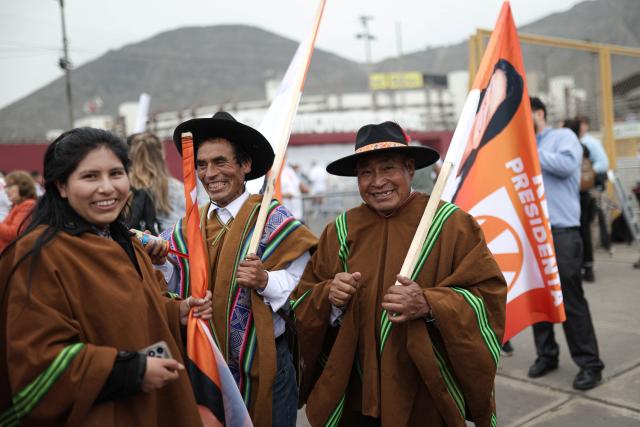 Supporters of Peru's presidential candidate for the Fuerza Popular party, Keiko Fujimori, hold flags as they wait for her arrival at a closing campaign rally in Lima on June 4, 2026. Right-wing candidate Keiko Fujimori and leftist Roberto Sanchez will face off in Peru's presidential runoff on June 7, 2026. (Photo by Anthony Nino de Guzman / AFP)