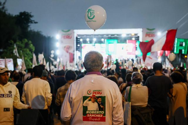 Supporters of Peru's presidential candidate for the Juntos por el Peru party, Roberto Sanchez, wait for the start of his closing campaign rally in Lima on June 4, 2026. Right-wing candidate Keiko Fujimori and leftist Roberto Sanchez will face off in Peru's presidential runoff on June 7, 2026. (Photo by Connie FRANCE / AFP)