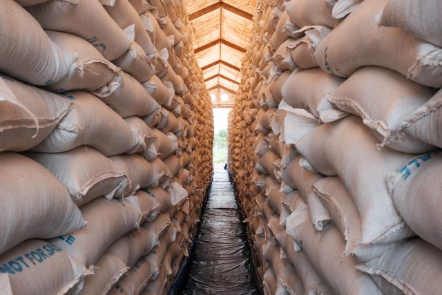 (FILES) Thousands of bags of Sorghum from the World Food Program sit in a warehouse ready for distribution in Maban, on August 20, 2025. Hundreds of thousands displaced by conflict in South Sudan are increasingly forced to sell part of their rations to pay for basic needs at a time when the economy has almost entirely collapsed. One of the world's poorest countries, South Sudan has been mired in corruption and civil war for much of its existence since gaining independence in 2011. When US President Donald Trump ordered the shutdown of USAID last year, South Sudan lost a huge chunk of its humanitarian support at a time when nearly two-thirds of the population -- some 7.9 million people -- face acute hunger. (Photo by GUY PETERSON / AFP)