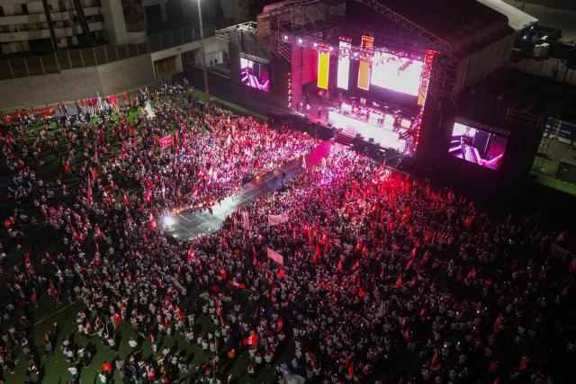 This aerial view shows supporters of Peru’s presidential candidate for the Fuerza Popular party, Keiko Fujimori, waiting for the start of her closing campaign rally in Lima on June 4, 2026. Right-wing candidate Keiko Fujimori and leftist Roberto Sanchez will face off in Peru's presidential runoff on June 7, 2026. (Photo by Anthony Nino de Guzman / AFP)