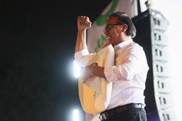 Peru's presidential candidate for the Juntos por el Peru party, Roberto Sanchez, gestures during his closing campaign rally in Lima on June 4, 2026. Right-wing candidate Keiko Fujimori and leftist Roberto Sanchez will face off in Peru's presidential runoff on June 7, 2026. (Photo by Connie FRANCE / AFP)