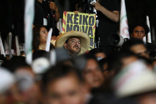 Supporters of Peru’s presidential candidate for the Juntos por el Peru party, Roberto Sanchez, react during his closing campaign rally in Lima on June 4, 2026. Right-wing candidate Keiko Fujimori and leftist Roberto Sanchez will face off in Peru's presidential runoff on June 7, 2026. (Photo by Connie FRANCE / AFP)