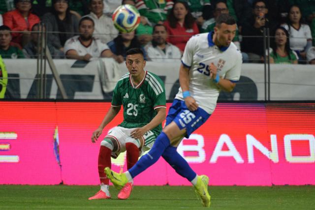 Mexico's midfielder #25 Roberto Alvarado and Serbia's defender #25 Stefan Bukinac fight for the ball during the international friendly football match between Mexico and Serbia at the Nemesio Diez Stadium in Toluca, Mexico on June 4, 2026. (Photo by Mario Vazquez / AFP)