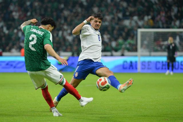 Mexico's defender #02 Jorge Sanchez and Serbia's midfielder #08 Dejan Zukic fight for the ball during the international friendly football match between Mexico and Serbia at the Nemesio Diez Stadium in Toluca, Mexico on June 4, 2026. (Photo by Mario Vazquez / AFP)