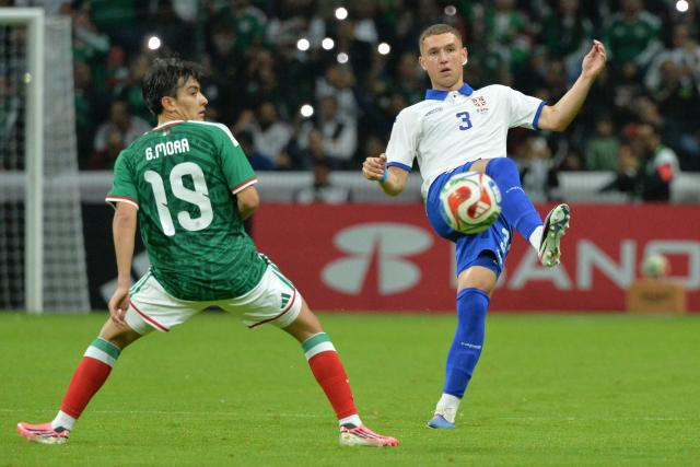 Mexico's midfielder #19 Gilberto Mora and Serbia's midfielder #03 Petar Petrovic fight for the ball during the international friendly football match between Mexico and Serbia at the Nemesio Diez Stadium in Toluca, Mexico on June 4, 2026. (Photo by Mario Vazquez / AFP)