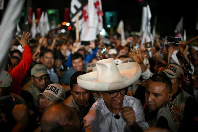 Peru's presidential candidate for the Juntos por el Peru party, Roberto Sanchez, greets supporters during his closing campaign rally in Lima on June 4, 2026. Right-wing candidate Keiko Fujimori and leftist Roberto Sanchez will face off in Peru's presidential runoff on June 7, 2026. (Photo by ERNESTO BENAVIDES / AFP)