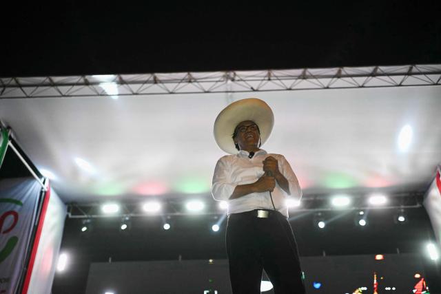 Peru's presidential candidate for the Juntos por el Peru party, Roberto Sanchez, gestures during his closing campaign rally in Lima on June 4, 2026. Right-wing candidate Keiko Fujimori and leftist Roberto Sanchez will face off in Peru's presidential runoff on June 7, 2026. (Photo by ERNESTO BENAVIDES / AFP)