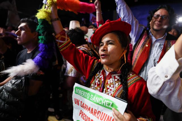 A supporter of Peru's presidential candidate for the Juntos por el Peru party, Roberto Sanchez, gestures during his closing campaign rally in Lima on June 4, 2026. Right-wing candidate Keiko Fujimori and leftist Roberto Sanchez will face off in Peru's presidential runoff on June 7, 2026. (Photo by Connie FRANCE / AFP)