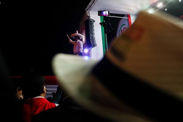 Peru's presidential candidate for the Juntos por el Peru party, Roberto Sanchez, gestures as he speaks to supporters during his closing campaign rally in Lima on June 4, 2026. Right-wing candidate Keiko Fujimori and leftist Roberto Sanchez will face off in Peru's presidential runoff on June 7, 2026. (Photo by Connie FRANCE / AFP)