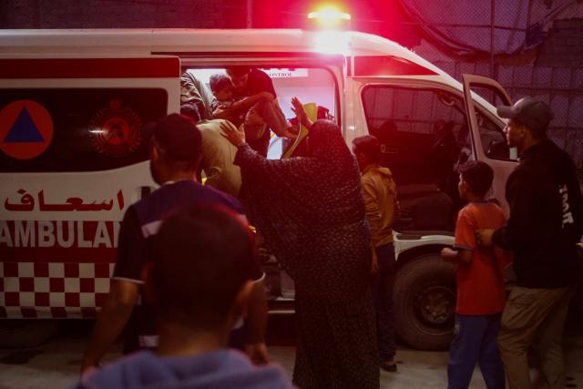 EDITORS NOTE: Graphic content / Emergency responders bring injured Palestinians to Nasser Hospital following an Israeli strike in Khan Yunis in the southern Gaza Strip on June 5, 2026. Despite a truce technically in effect since October 2025, daily violence has rocked the Gaza Strip, over half of which is under Israeli military control in defiance of the ceasefire's terms. Israel has killed at least 936 people since the ceasefire began, according to Gaza's health ministry, which operates under Hamas authority and whose figures are considered reliable by the UN. (Photo by Bashar Taleb / AFP)