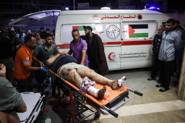 EDITORS NOTE: Graphic content / mergency responders bring an injured Palestinian on a stretcher into Nasser Hospital following an Israeli strike in Khan Yunis in the southern Gaza Strip on June 5, 2026. Despite a truce technically in effect since October 2025, daily violence has rocked the Gaza Strip, over half of which is under Israeli military control in defiance of the ceasefire's terms. Israel has killed at least 936 people since the ceasefire began, according to Gaza's health ministry, which operates under Hamas authority and whose figures are considered reliable by the UN. (Photo by Bashar Taleb / AFP)