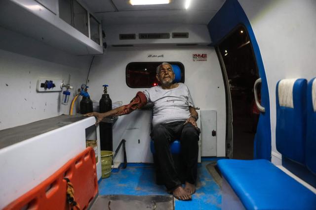 EDITORS NOTE: Graphic content / An injured Palestinian man waits in an ambulance as he is brought to Nasser Hospital following an Israeli strike in Khan Yunis in the southern Gaza Strip on June 5, 2026. Despite a truce technically in effect since October 2025, daily violence has rocked the Gaza Strip, over half of which is under Israeli military control in defiance of the ceasefire's terms. Israel has killed at least 936 people since the ceasefire began, according to Gaza's health ministry, which operates under Hamas authority and whose figures are considered reliable by the UN. (Photo by Bashar Taleb / AFP)