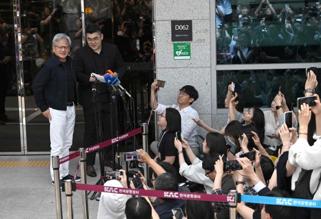 Nvidia CEO Jensen Huang speaks to reporters as he arrives at Gimpo airport in Seoul on June 5, 2026. (Photo by Jung Yeon-je / AFP)