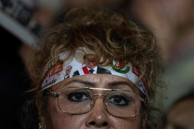 A supporter of Roberto Sanchez, Peru's presidential candidate for the Juntos por el Peru party, listens his speech during his closing campaign rally in Lima on June 4, 2026. Right-wing candidate Keiko Fujimori and leftist Roberto Sanchez will face off in Peru's presidential runoff on June 7, 2026. (Photo by Ernesto BENAVIDES / AFP)