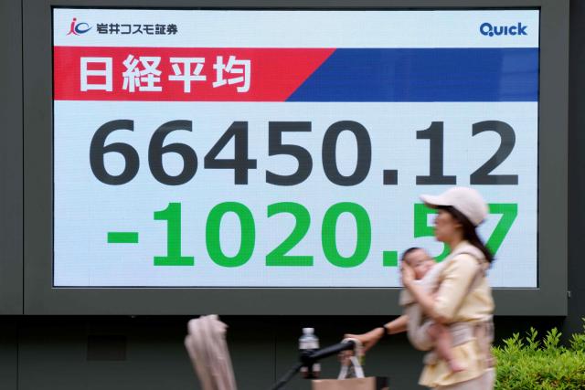 An electronic quotation board displays the Nikkei Stock Average on the Tokyo Stock Exchange along a street in Tokyo on June 5, 2026. (Photo by Kazuhiro NOGI / AFP)