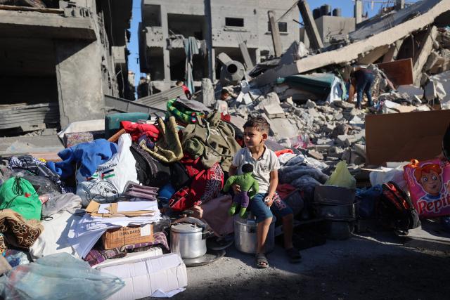 A Palestinian boy sits near debris of a destroyed house following an Israeli strike after residents were warned to evacuate before the attack, in Zawaida in the central Gaza Strip on June 5, 2026. Despite a truce technically in effect since October 2025, daily violence has rocked the Gaza Strip, over half of which is under Israeli military control in defiance of the ceasefire's terms. Israel has killed at least 936 people since the ceasefire began, according to Gaza's health ministry, which operates under Hamas authority and whose figures are considered reliable by the UN. (Photo by Eyad Baba / AFP)