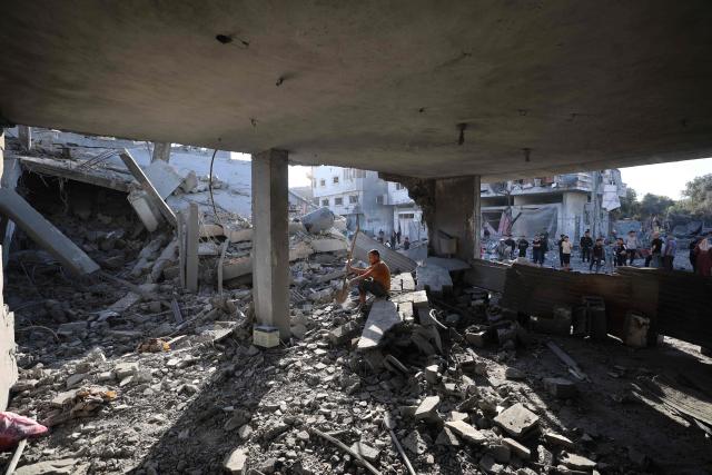 A Palestinian man sits amid debris at the site of an Israeli strike on a house whose residents were warned to evacuate before the attack, in Zawaida in the central Gaza Strip on June 5, 2026. Despite a truce technically in effect since October 2025, daily violence has rocked the Gaza Strip, over half of which is under Israeli military control in defiance of the ceasefire's terms. Israel has killed at least 936 people since the ceasefire began, according to Gaza's health ministry, which operates under Hamas authority and whose figures are considered reliable by the UN. (Photo by Eyad Baba / AFP)