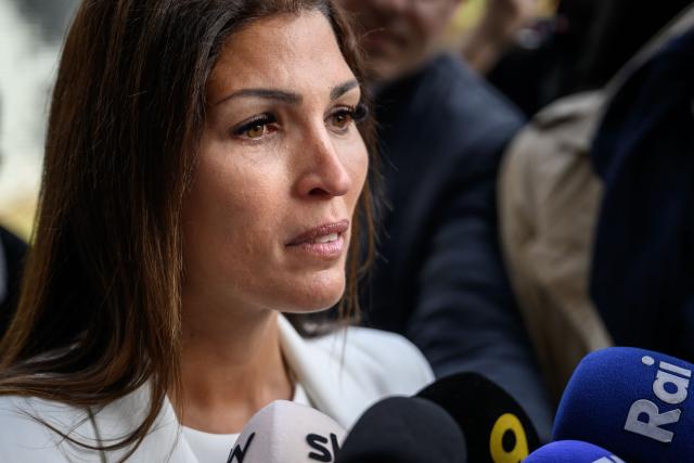 Laetitia Brodard-Sitre, the mother of Arthur who died in the fire, speaks to journalists upon her arrival for a hearing of owners of Le Constellation as part of the inquiry into a devastating New Year's fire, in Sion on June 5, 2026. The French couple Jacques and Jessica Moretti were to be cross-examined by public prosecutors and lawyers for civil parties caught up in the blaze that engulfed Le Constellation bar in Crans-Montana in the early hours of January 1, 2026. The tragedy killed 41 people, mostly teenagers, and injured 115 others. (Photo by Fabrice COFFRINI / AFP)