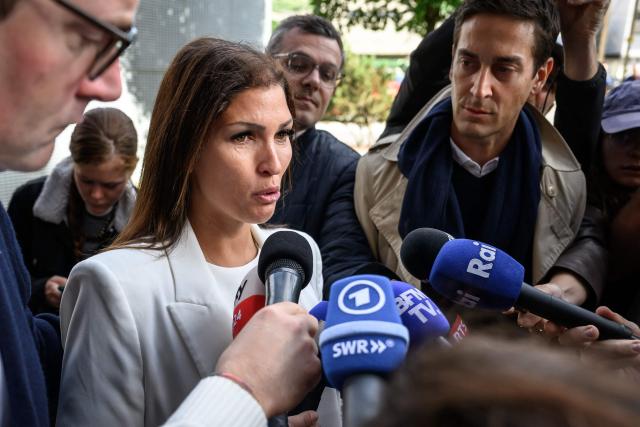 Laetitia Brodard-Sitre, the mother of Arthur who died in the fire, speaks to journalists upon her arrival for a hearing of owners of Le Constellation as part of the inquiry into a devastating New Year's fire, in Sion on June 5, 2026. The French couple Jacques and Jessica Moretti were to be cross-examined by public prosecutors and lawyers for civil parties caught up in the blaze that engulfed Le Constellation bar in Crans-Montana in the early hours of January 1, 2026. The tragedy killed 41 people, mostly teenagers, and injured 115 others. (Photo by Fabrice COFFRINI / AFP)