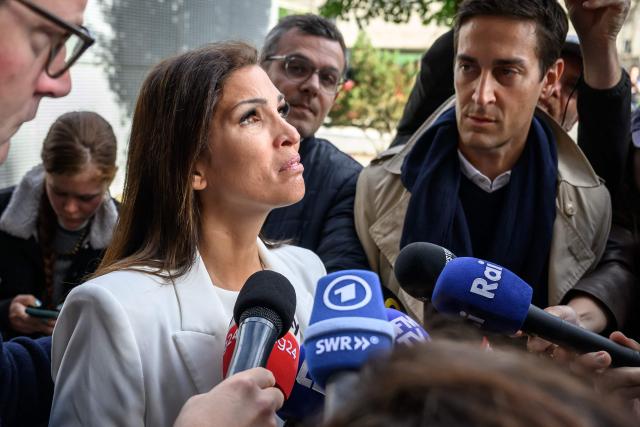 Laetitia Brodard-Sitre, the mother of Arthur who died in the fire, reacts while talking to journalists upon her arrival for a hearing of owners of Le Constellation as part of the inquiry into a devastating New Year's fire, in Sion on June 5, 2026. The French couple Jacques and Jessica Moretti were to be cross-examined by public prosecutors and lawyers for civil parties caught up in the blaze that engulfed Le Constellation bar in Crans-Montana in the early hours of January 1, 2026. The tragedy killed 41 people, mostly teenagers, and injured 115 others. (Photo by Fabrice COFFRINI / AFP)