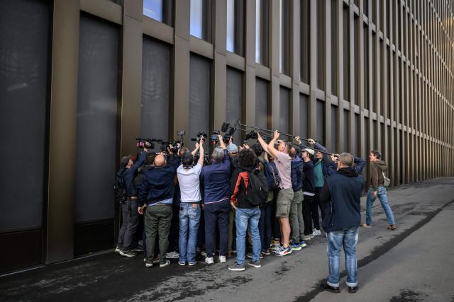 Journalists surround a lawyer prior to a hearing of owners of Le Constellation as part of the inquiry into a devastating New Year's fire, in Sion on June 5, 2026. The French couple Jacques and Jessica Moretti were to be cross-examined by public prosecutors and lawyers for civil parties caught up in the blaze that engulfed Le Constellation bar in Crans-Montana in the early hours of January 1, 2026. The tragedy killed 41 people, mostly teenagers, and injured 115 others. (Photo by Fabrice COFFRINI / AFP)