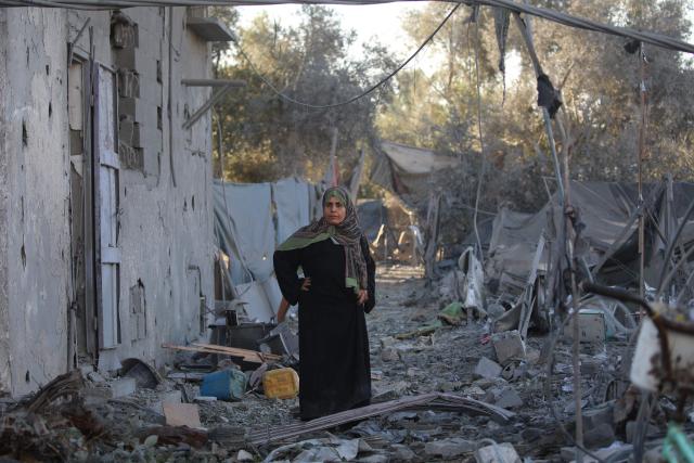 A Palestinian woman stands at the site of an Israeli strike on a house whose residents were warned to evacuate before the attack, in Zawaida central Gaza Strip on June 5, 2026. Despite a truce technically in effect since October 2025, daily violence has rocked the Gaza Strip, over half of which is under Israeli military control in defiance of the ceasefire's terms. Israel has killed at least 936 people since the ceasefire began, according to Gaza's health ministry, which operates under Hamas authority and whose figures are considered reliable by the UN. (Photo by Eyad Baba / AFP)