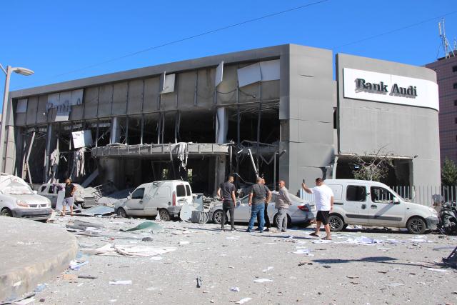 People inspect the aftermath at the site of an Israeli strike that hit the previous day in the southern Lebanese coastal city of Tyre on June 5, 2026. Israeli strikes overnight in the south Lebanon city of Tyre killed seven people, a source from Lebanon's civil defence told AFP on June 5, despite a ceasefire in the Israel-Hezbollah war. (Photo by Kawnat HAJU / AFP)