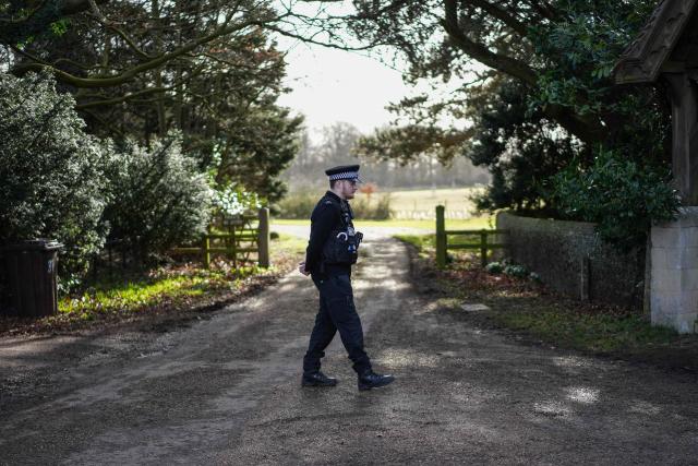 (FILES) A policeman stands guard at an entrance to Wood Farm on the royal family's Sandringham Estate in Norfolk, eastern England on February 22, 2026, after Britain's former prince Andrew was arrested on February 19. The disgraced former prince Andrew earned a private income from subletting cottages while paying a symbolic "peppercorn rent" for a mansion for over two decades, the UK government auditor revealed June 5, 2026. (Photo by CARLOS JASSO / AFP)