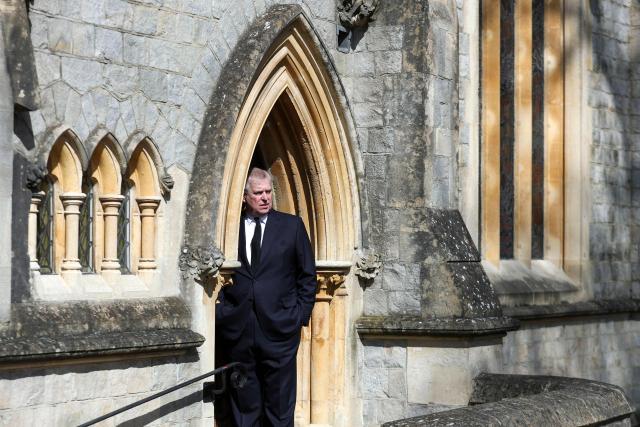(FILES) Police officers walk towards the entrance to Royal Lodge, a 30-room property and former residence to Britain's former prince Andrew where police said they are still conducting a search, in Windsor, west of London on February 20, 2026, a day after Andrew Mountbatten-Windsor was arrested on the royal family's remote Sandringham estate in eastern England. The disgraced former prince Andrew earned a private income from subletting cottages while paying a symbolic "peppercorn rent" for a mansion for over two decades, the UK government auditor revealed June 5, 2026. (Photo by Steve Parsons / POOL / AFP)