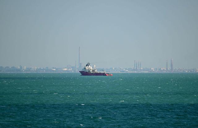 Picture taken on May 18, 2026 shows a ship at the entrance to the port of Constanta, Romania. A sea drone exploded early Friday, June 5, 2026 in Romania's Black Sea port of Constanta without causing casualties, a week after an aerial drone crashed into an apartment building in the country, injuring two. (Photo by Daniel MIHAILESCU / AFP)