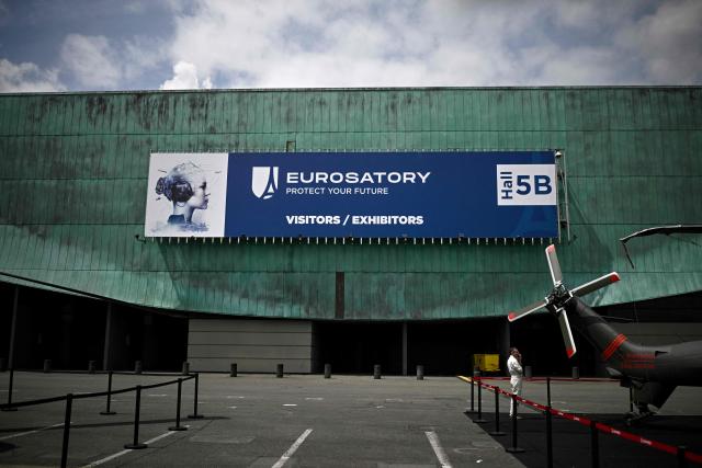 (FILES) A visitor stands next to the tail of an aircraft during the Eurosatory international land, air defence and security trade fair, in Villepinte, a northern suburb of Paris, on June 17, 2024. Faced with the Russian threat, which has exposed their vulnerabilities, Europeans will be looking for quick solutions at the 2026 Eurosatory trade show—an event marked by Ukraine’s growing influence and the official presence of “defensive” technologies from Israel’s Iron Dome system, according to the show’s commissione (Photo by JULIEN DE ROSA / AFP)