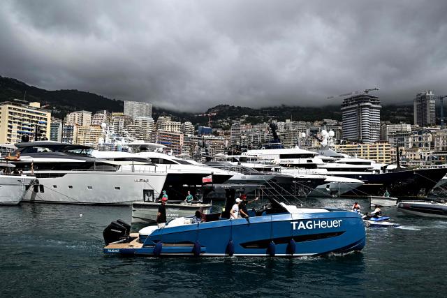 VIP guests arrive on sponsors' boats on the Monaco Bay ahead of the first practice session at the Monaco street circuit in Monaco, ahead of the Monaco Formula 1 Grand Prix, on June 5, 2026. (Photo by Gabriel BOUYS / AFP)