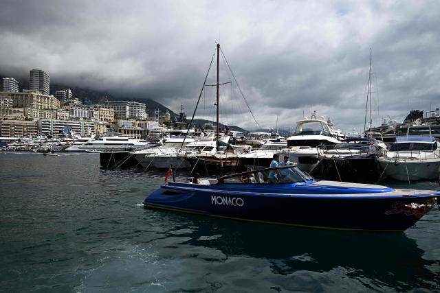 VIP guests arrive on sponsors' boats on the Monaco Bay ahead of the first practice session at the Monaco street circuit in Monaco, ahead of the Monaco Formula 1 Grand Prix, on June 5, 2026. (Photo by Gabriel BOUYS / AFP)