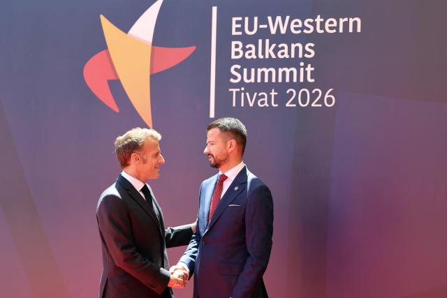 Montenegrin President Jakov Milatovic (R) shakes hands with French President Emmanuel Macron (L) ahead of the EU-Western Balkans Summit at Porto Montenegro in Tivat on June 5, 2026. The summit brings together leaders from EU member states and the six Western Balkans partners to discuss enlargement and gradual integration into the EU single market. (Photo by Ludovic MARIN / AFP)