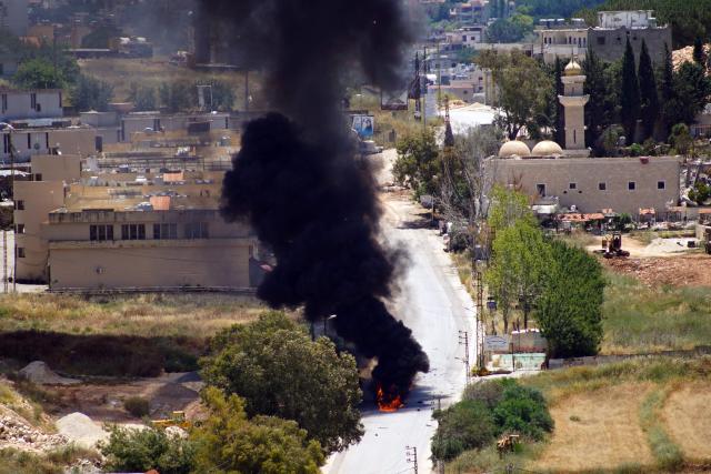 Smoke rises from a vehcile targeted by an Israeli drone attack in the southern Lebanese city of Nabatieh on June 5, 2026. Israeli strikes overnight in the south Lebanon city of Tyre killed seven people, a source from Lebanon's civil defence told AFP on June 5, despite a ceasefire in the Israel-Hezbollah war. (Photo by Abbas Fakih / AFP)