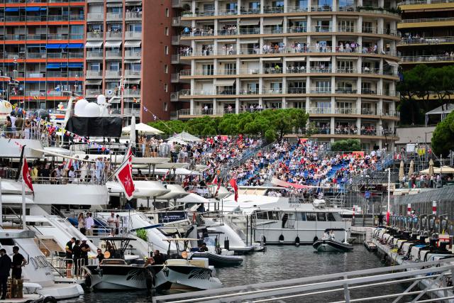 Members of the public wait for the start of the first practice session at the Monaco street circuit in Monaco, ahead of the Monaco Formula 1 Grand Prix, on June 5, 2026. (Photo by Andrej ISAKOVIC / AFP)