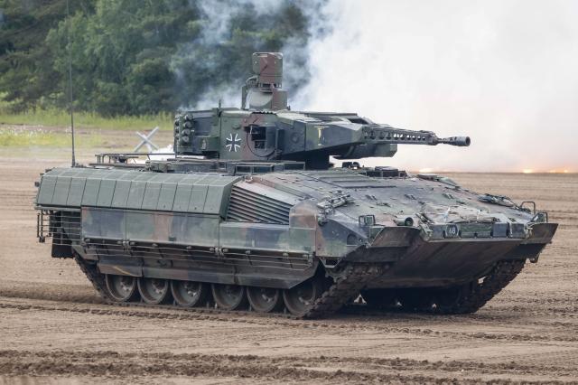 A "Puma" infantry fighting armoured vehicle of the German armed forces Bundeswehr operates during an exercise of the Panzergrenadier (armoured infantrymen) Training Bataillon 92 during the so-called Spotters' Day at the military training area in Munster, northern Germany, on June 5, 2026. Along with nine other locations, the Munster site is hosting the Bundeswehr Day open day of the German armed forces on June 6, 2026. (Photo by FOCKE STRANGMANN / AFP)
