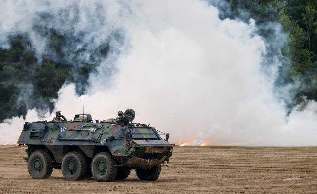 A "Transportpanzer Fuchs" armoured personnel carrier of the German armed forces Bundeswehr is seen during an exercise of the Panzergrenadier (armoured infantrymen) Training Bataillon 92 during the so-called Spotters' Day at the military training area in Munster, northern Germany, on June 5, 2026. Along with nine other locations, the Munster site is hosting the Bundeswehr Day open day of the German armed forces on June 6, 2026. (Photo by FOCKE STRANGMANN / AFP)