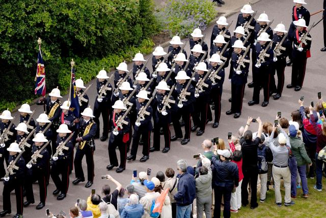 The Band of the Royal Marines performs ahead of a ceremony for the presentation of New Colours to the 40, 42, 43 and 45 Commando Royal Marines, at Windsor Castle, June 5, 2026. (Photo by Jordan Pettitt / POOL / AFP)