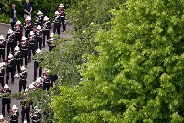 The Band of the Royal Marines performs ahead of a ceremony for the presentation of New Colours to the 40, 42, 43 and 45 Commando Royal Marines, at Windsor Castle, June 5, 2026. (Photo by Jordan Pettitt / POOL / AFP)