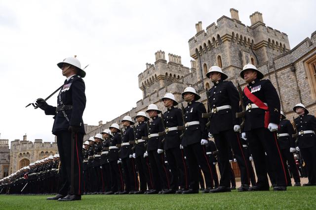 Royal Marines attend a ceremony for the presentation of New Colours to the 40, 42, 43 and 45 Commando Royal Marines, at Windsor Castle, June 5, 2026. (Photo by Aaron Chown / POOL / AFP)